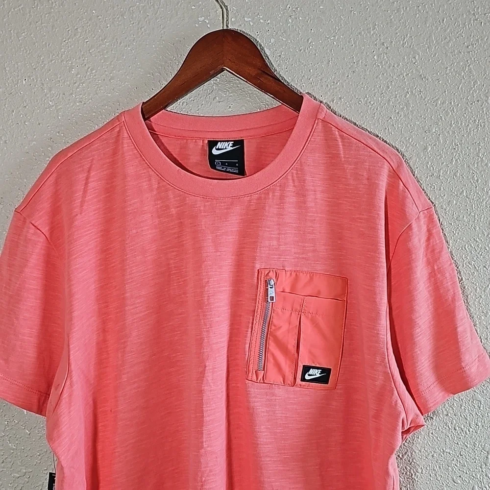 Nike Zip Pocket T-Shirt.